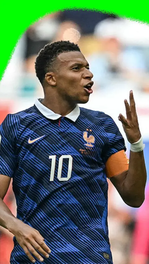 Kylian Mbappe shows three fingers after scoring France's third goal against England in the 2026 World Cup third place final.