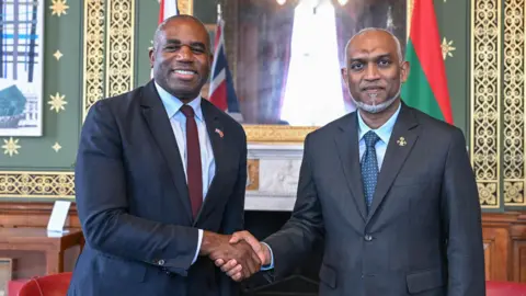 The President's Office of the Republic of the Maldives Maldives President Mohamed Muizzu (right) meeting Deputy Prime Minister David Lammy during a UK visit in July 2025
