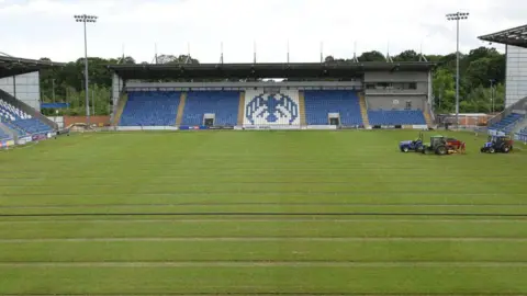 Colchester United FC Vehicles on the pitch at Colchester United's home ground