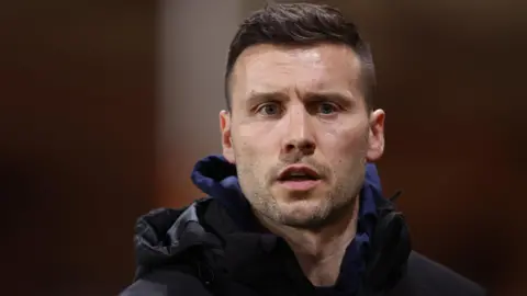 Mat Sadler on the touchline