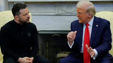 EPA Zelensky sits in his usual black attire opposite Donald Trump, wearing a red tie and blue suit, during an angry exchange in the Oval Office