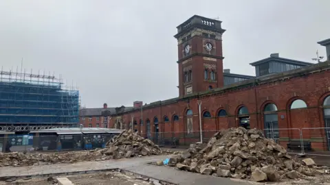 Photograph of redevelopment work in front of the indoor market hall in Ashton-under-Lyne