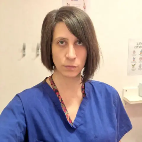 Alicia Arias Alicia Arias in her blue nurses scrubs