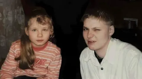 An old photograph of Izabela next to Katarzyna when she was a young child