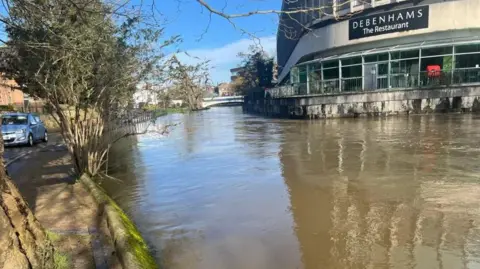 BBC The flooding outside a shopping centre in Millmead