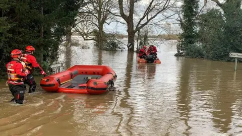 West Midlands Fire Service Firefighters carrying out rescue water