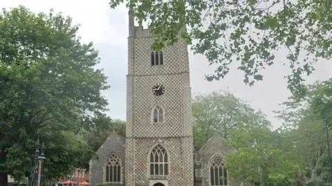 Outside Reading Minster Church in Reading on a cloudy day.