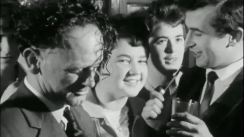 men and women celebrating Hen Galan in a black and white photo