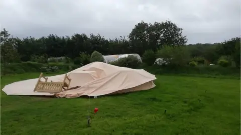 Toby Rhys-Davies A large tent blow down