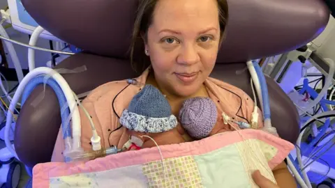 Jade Crane Jade Crane with the twins at four weeks