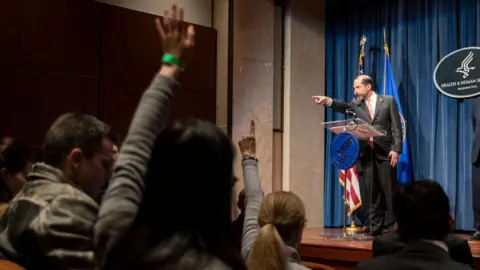 Getty Images The US health secretary briefs reporters on Covid-19, which originated in China