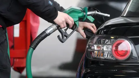 PA Man filling up at the pump