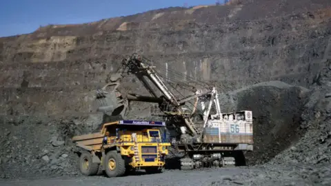 Vehicles at a Ukrainian iron ore mine