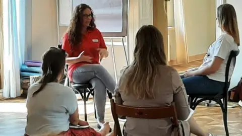 Rachel Young Rachel offering psychological support to volunteers in Poland