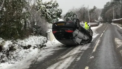 car overturned on the A487 at Rhiw Penglais near Aberystwyth, Ceredigion