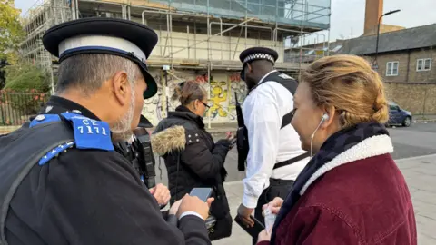 The police showing people how to protect themselves against phone theft. 