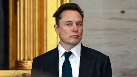 Elon Musk wearing a sharp black suit and tie