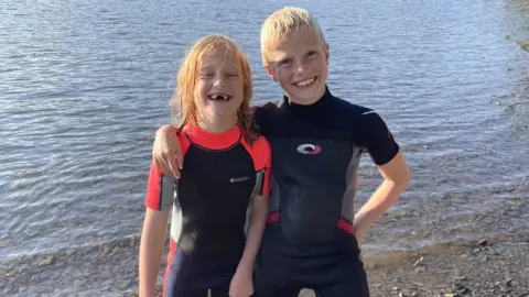 Robert Isaac and his sister Milly