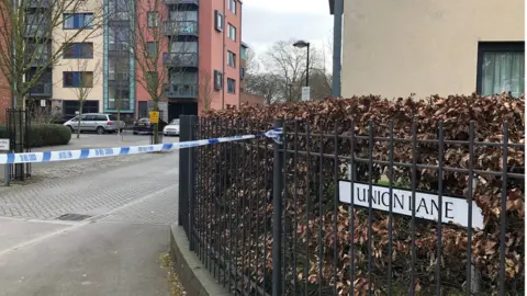 PA Police activity outside a block of flats on Union Lane, Isleworth