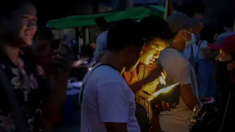 BBC Traders at the jade market near the mines.