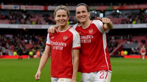 Cloe Lacasse and Laia Codina of Arsenal celebrate victory against Manchester United
