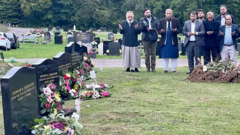 Stephen Huntley/BBC Prayers were held at the cemetery where five members of Dr Abdul Shakoor's family are buried