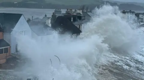 A view of waves breaking over the sea defences in Torcross, Devon, during the winter storms in January and February, 2026