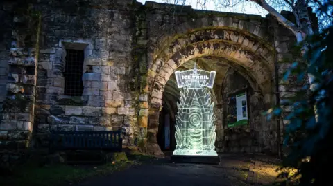 Make it York A large ice sculpture against a ruined wall in York's Museum Gardens