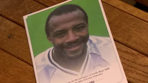 Service flyer featuring Cyrille's face