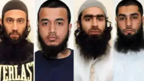 Custody photos of the four men all of them have black beards.