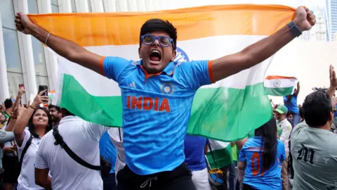 An India fan celebrates after they beat Pakistan at the T20 World Cup