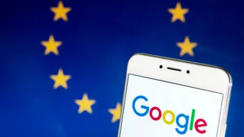 Getty Images The Google logo on a smartphone with the EU flag in the background