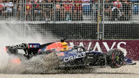 Gravel flies up as Red Bull's Max Verstappen crashes in qualifying for the Australian Grand Prix
