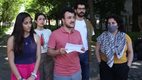 Mahmoud Khalil speaks at a press event with other Columbia University protesters