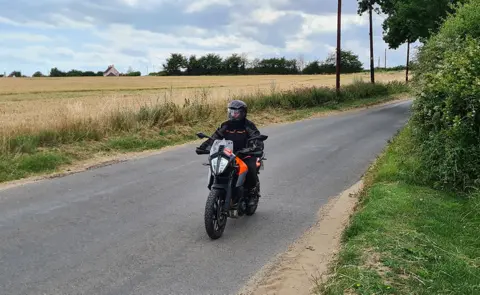 John Griffin Michelle Griffin on a motorbike