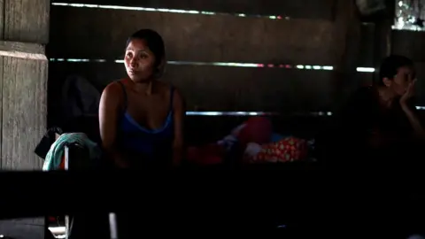 Reuters Claudia Maquin, mother of Jakelin Caal, waits for the arrival of her daughter"s coffin in San Antonio Secortez village, Guatemala, 22 December 2018