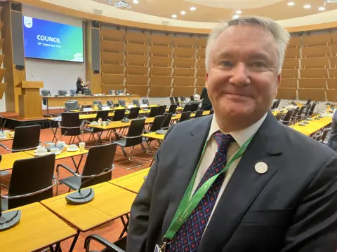 BBC/Amy Holmes A picture of independent councillor Stuart Wilson in a dark grey jacket with a blue tie with red spots on.