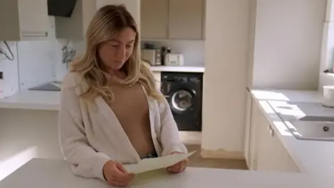 Screenhouse Productions Kelly Bossons with her daughter's updated birth certificate