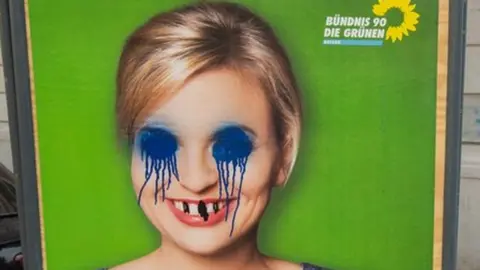 defaced picture of Green party politician