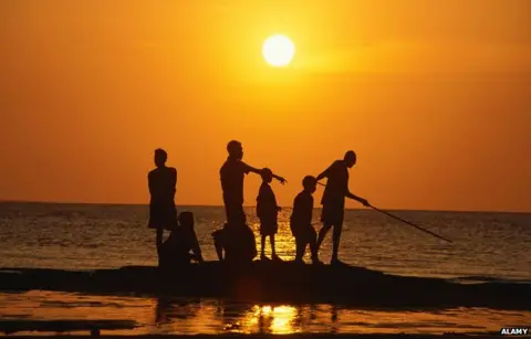 Alamy Aboriginal people fishing from rock outcrop, Galiwinku island, Arnhem Land