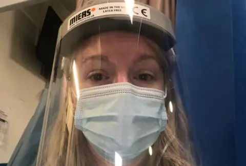 PA Media Hazel Harrison wearing PPE to visit her son, Michael Harrison