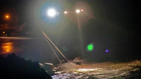 Bagg Robinson Helicopter hovers over yacht in sea