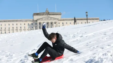 Pacemaker Boy sledding past Stormont