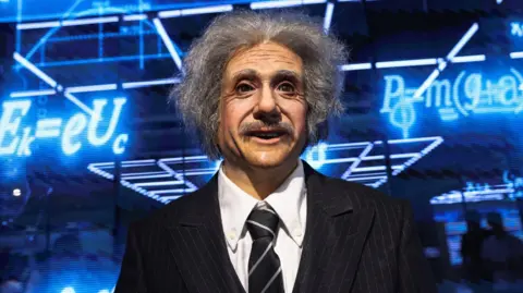 Reuters A humanoid robot in the likeness of late physicist Albert Einstein stands behind a price tag, during an organised media tour to Robot Mall, a store selling humanoid and other robots, in Beijing.