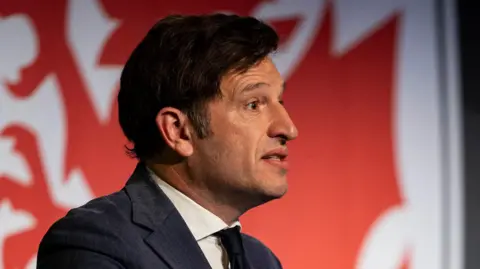 Noel Mooney speaks at a coaching conference 