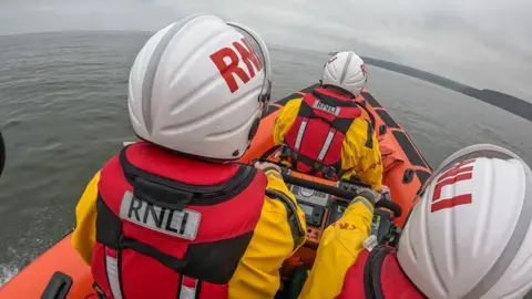 Staithes and Runswick Bay volunteers in lifeboat heading out towards Kettleness