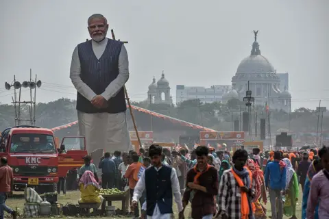 NurPhoto via Getty Images A cutout of Prime Minister Narendra Modi is seen during a political gathering of Bharatiya Janata Party (BJP) supporters in Kolkata, India, on March 14, ahead of assembly elections in West Bengal. (Photo by Debarchan Chatterjee/NurPhoto via Getty Images)