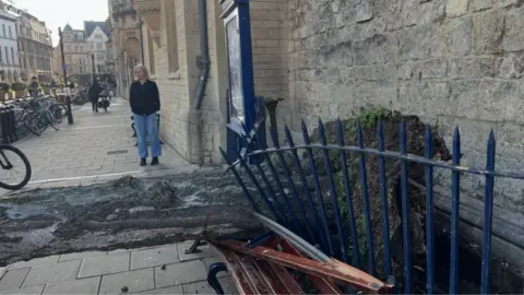 Matthew Shaw A fallen tree blocking a path in Oxford City Centre