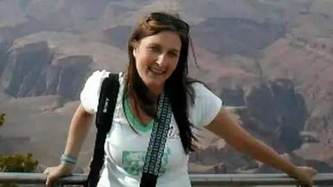 Police Scotland Police handout of Suzanne Pilley, with her standing in front of hills