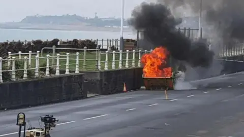 Sussex Police Flames from a controlled explosion along St Leonards seafront